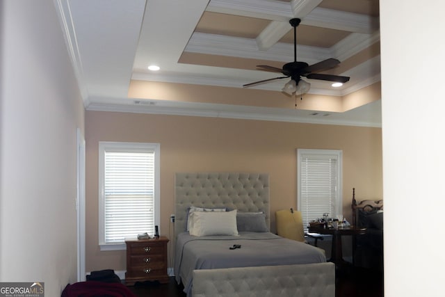 bedroom with a raised ceiling, crown molding, coffered ceiling, and beam ceiling