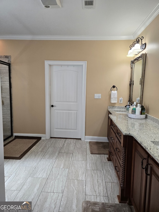 bathroom with vanity and crown molding