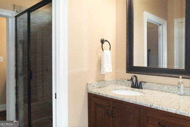 bathroom featuring vanity and walk in shower