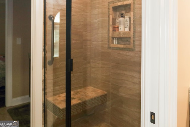 bathroom featuring a tile shower