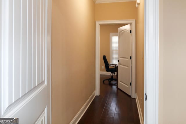 corridor with dark hardwood / wood-style flooring