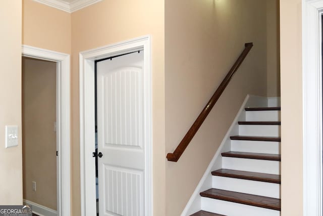 stairway with crown molding