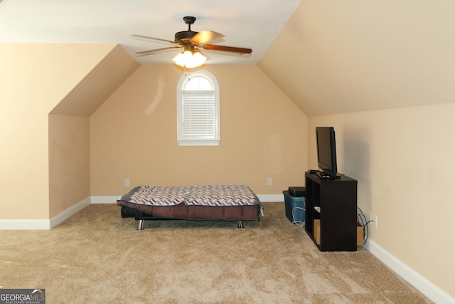 carpeted bedroom featuring vaulted ceiling and ceiling fan