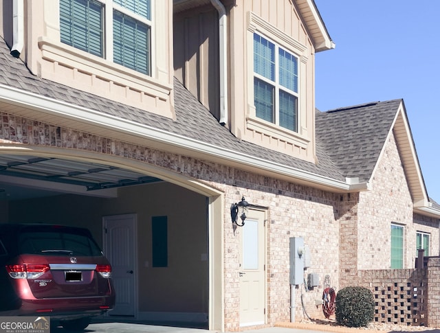 view of exterior entry with a garage