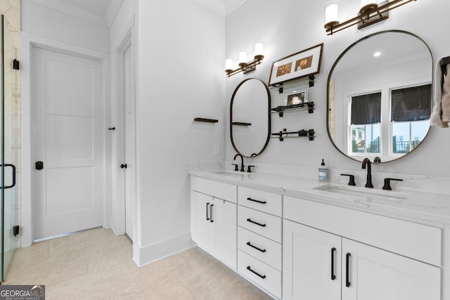 bathroom with vanity, crown molding, and walk in shower