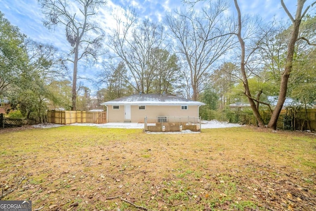 rear view of house with a patio area and a lawn