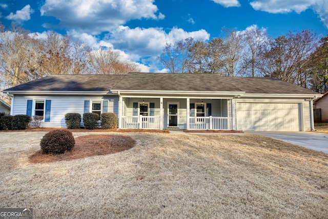 ranch-style home featuring a garage, a porch, and a front lawn