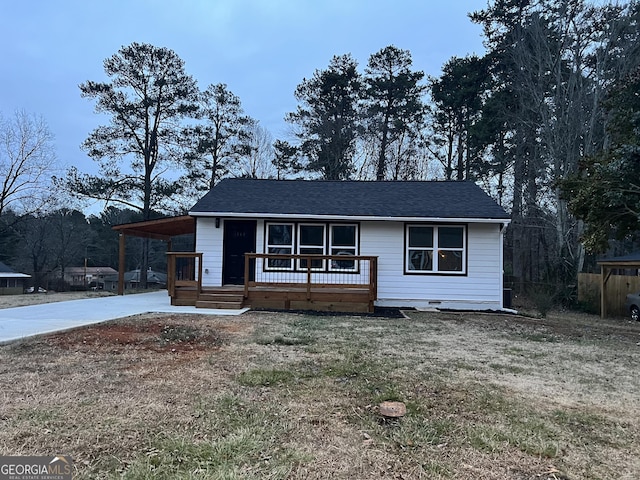 ranch-style home featuring a carport