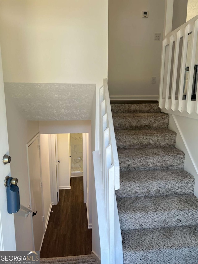 stairway featuring hardwood / wood-style floors