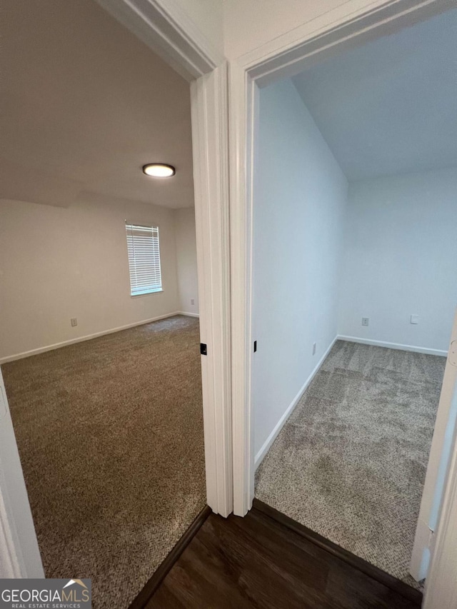 interior space with dark colored carpet