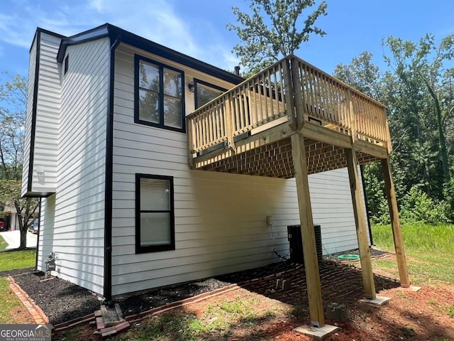 view of property exterior with a deck