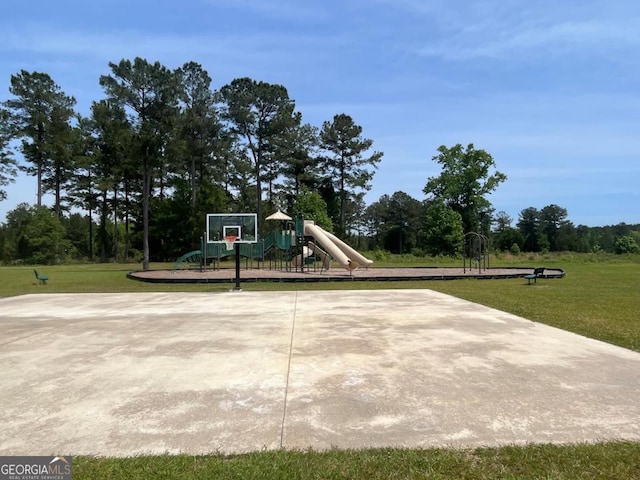 view of basketball court with community basketball court, a lawn, and playground community