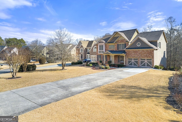 view of front of home with a garage and a front lawn