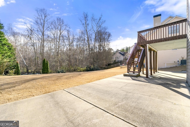 view of yard with a patio area, central AC, and a deck