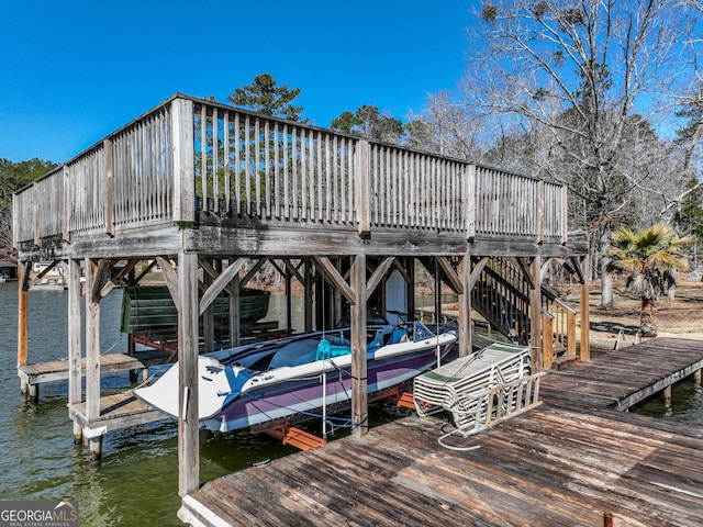 dock area with a water view and boat lift