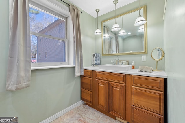 bathroom featuring baseboards and vanity