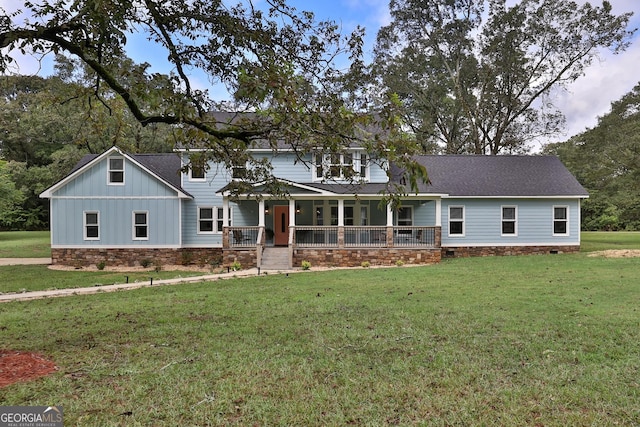 view of front of house with a front yard and a porch