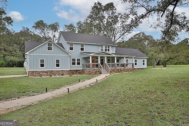 view of front of property with a front lawn and a porch