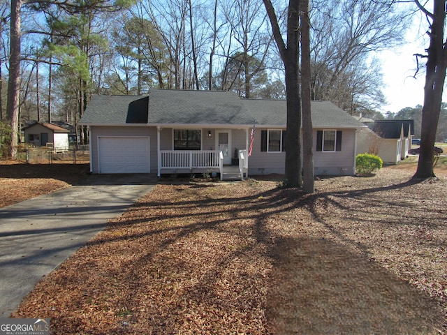 single story home featuring a garage and a porch