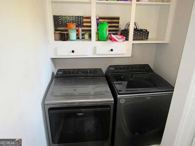 clothes washing area featuring independent washer and dryer