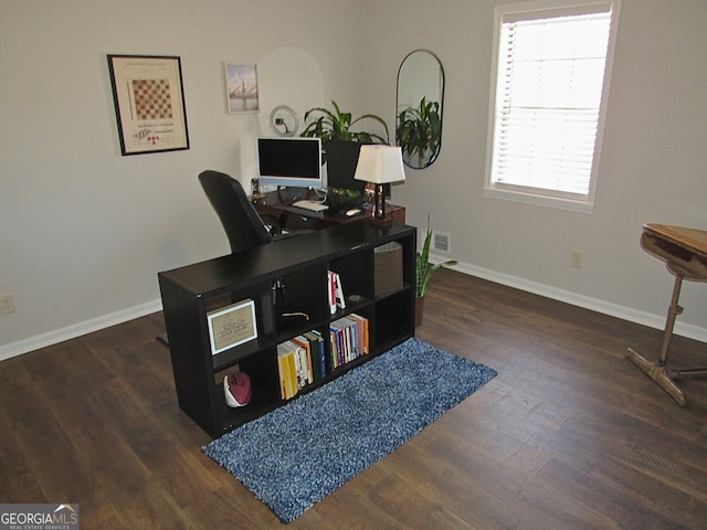 office space with dark hardwood / wood-style flooring