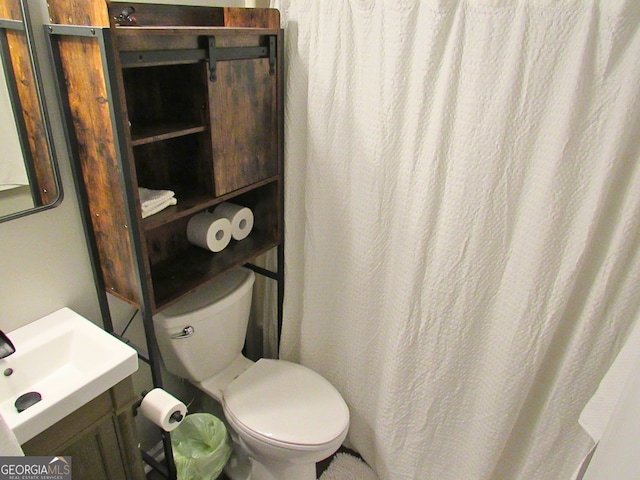 bathroom featuring toilet and sink