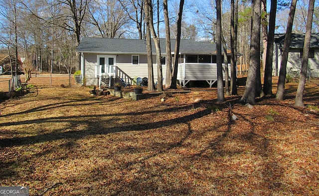 back of house featuring french doors