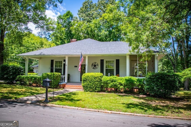 view of front of property with a porch and a front yard