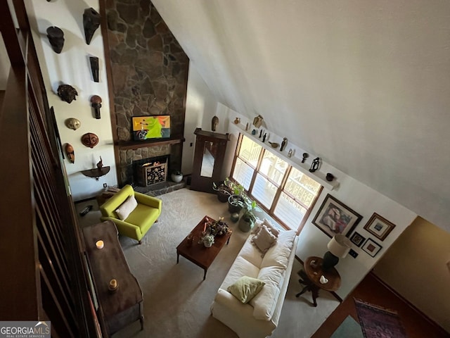 living room with a stone fireplace