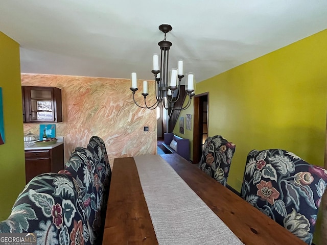 dining space with a notable chandelier