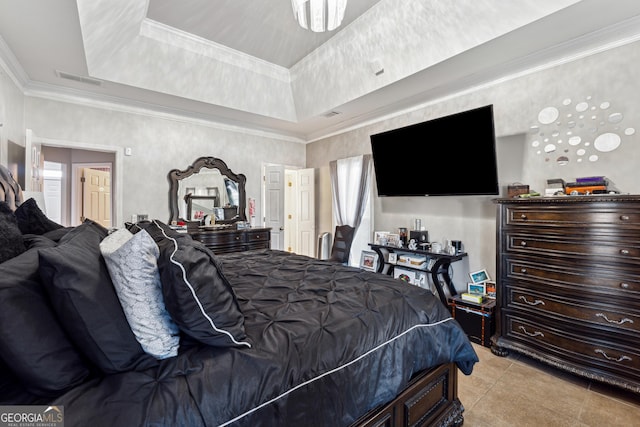 tiled bedroom featuring crown molding and a tray ceiling