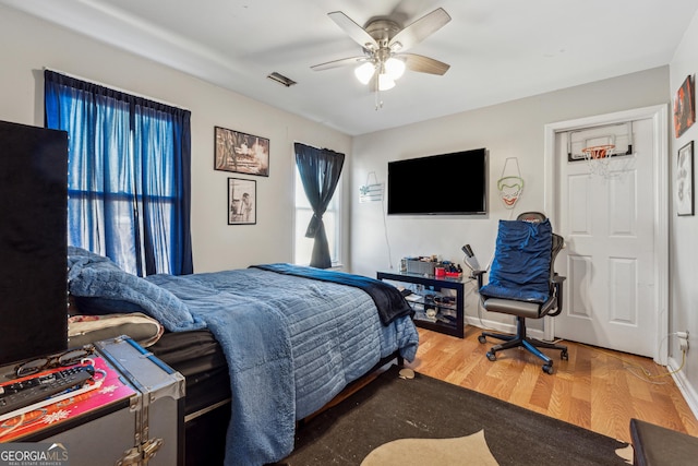 bedroom featuring wood-type flooring and ceiling fan