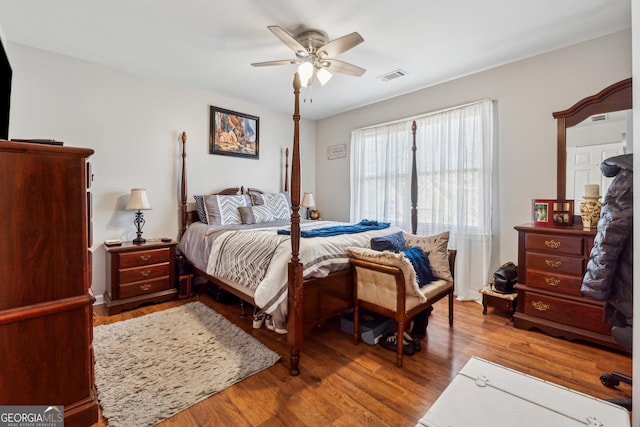 bedroom featuring hardwood / wood-style floors and ceiling fan