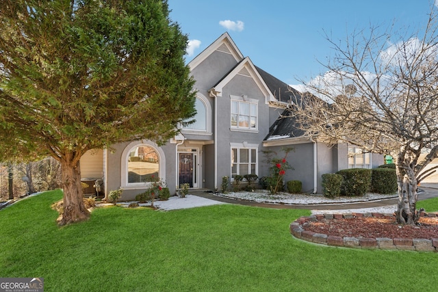 front facade featuring a front lawn