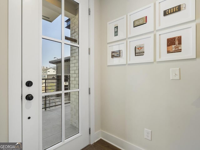 doorway featuring dark hardwood / wood-style floors