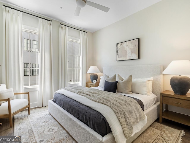 bedroom featuring ceiling fan and light hardwood / wood-style flooring