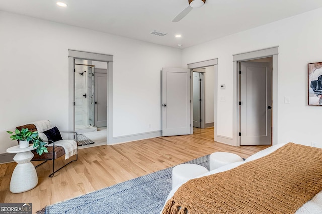 sitting room with hardwood / wood-style flooring and ceiling fan