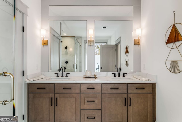 bathroom with vanity and an enclosed shower