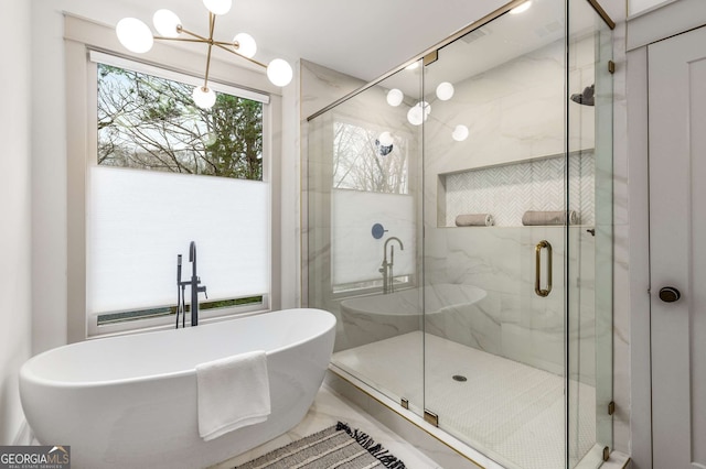 bathroom featuring shower with separate bathtub