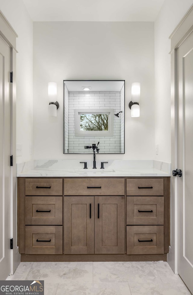 bathroom featuring vanity and a shower