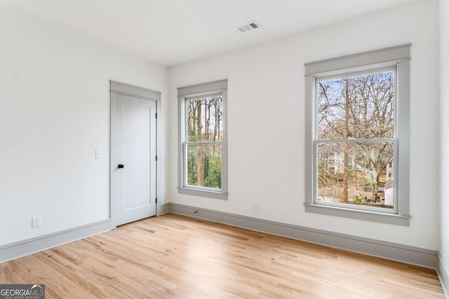 unfurnished room featuring light hardwood / wood-style flooring