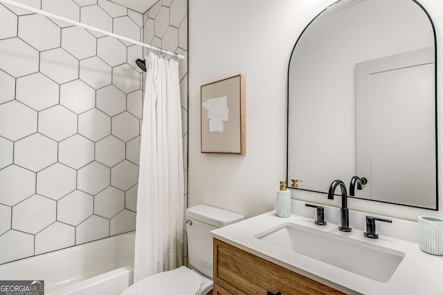 full bathroom featuring vanity, shower / tub combo with curtain, and toilet