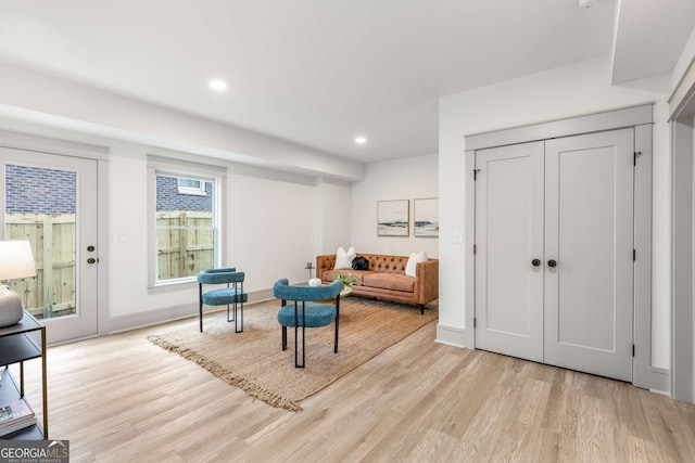 sitting room with light hardwood / wood-style flooring