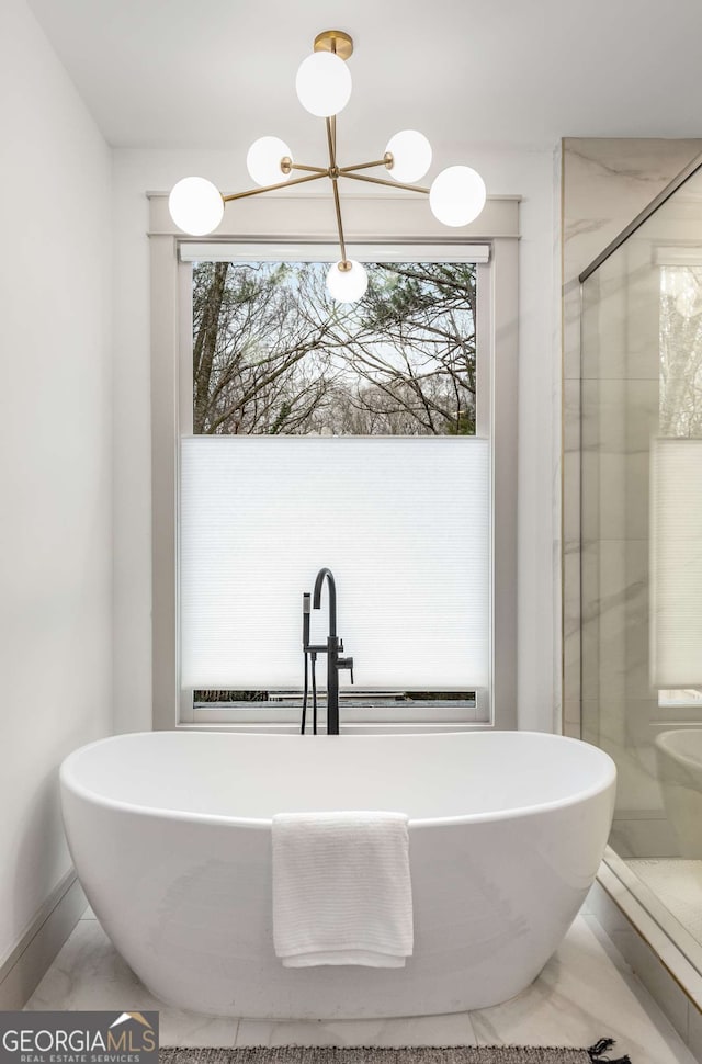 bathroom featuring independent shower and bath