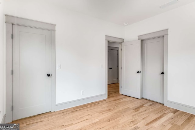 unfurnished bedroom featuring light hardwood / wood-style flooring