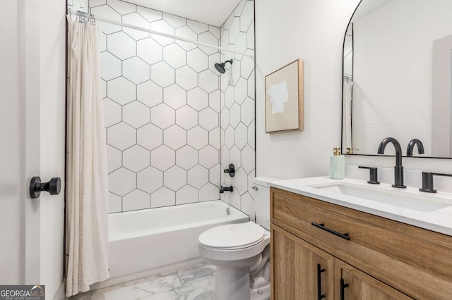 full bathroom with vanity, shower / bath combo, and toilet