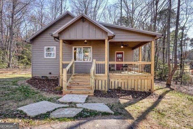 bungalow-style home with a porch and ceiling fan