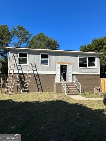 exterior space featuring a front lawn