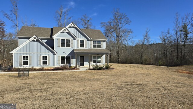 view of front of property featuring a porch and a front yard