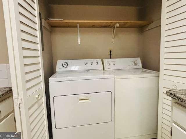 washroom featuring separate washer and dryer